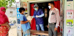 Treating patient by veterinary doctor wearing head cover, face mask, face shield and hand gloves